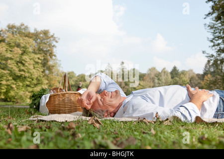 Man lying relaxed on a blanket Stock Photo