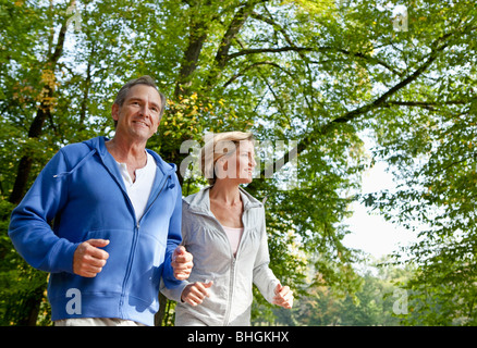 Middle aged couple jogging Stock Photo