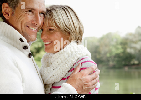 Middle aged couple hugging Stock Photo