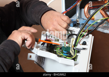 Installation of a new Vaillant ecotech  637 condensing boiler. Stock Photo