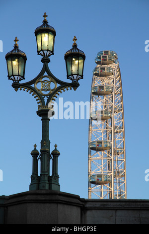 Lantern on Waterloo Bridge and London Eye, winter sunrise Stock Photo