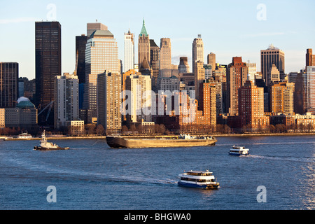 Tugboat, barge and NY Waterways Ferries on the Hudson in New York City Stock Photo