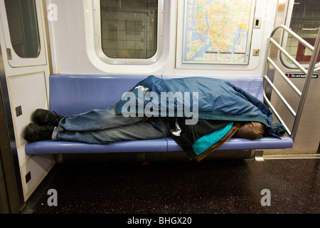 Homeless man sleeping on a subway train in New York on Saturday, March ...