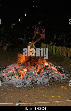 Exclusive & Very rare photograph of Agnikavadi,Agnikkavady,Agnikavady  ( Fire Walk ) . Clear view of Burning Legs of Devotee Stock Photo