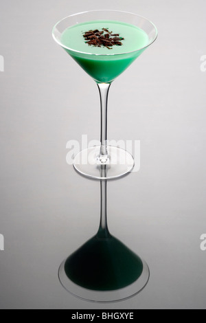 Grasshopper cocktail with shaved chocolate garnish on gray background Stock Photo