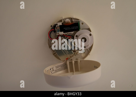 The inside of a smoke alarm with the battery in place Stock Photo