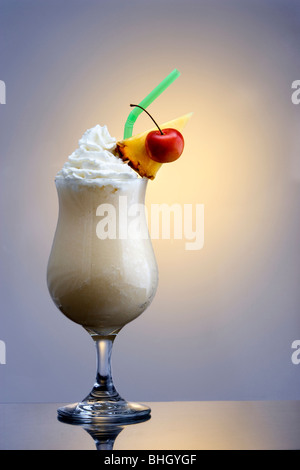 Pina Colada mixed drink on plain background with reflection Stock Photo