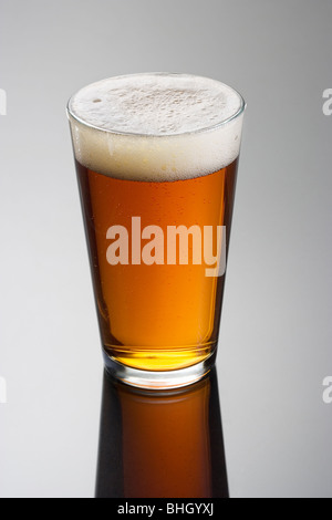 Glass of beer on a gray backgeround Stock Photo