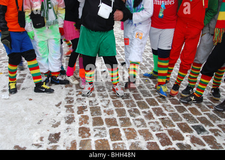 group of youngsters wearing the traditional Carnival colours red yellow and green at Dutch carnival celebration Stock Photo