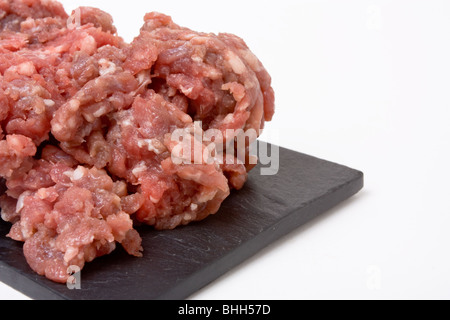 Ground or minced beef from low viewpoint up close against white background. Stock Photo
