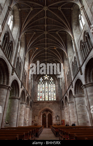 The vaulted ceiling/roof at Hereford Cathedral looks down on the Nave,the West Door and Window also attendance. Stock Photo