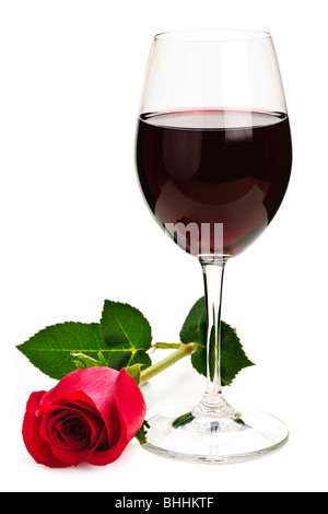 Romantic glass of red wine with long stemmed rose isolated on white background Stock Photo