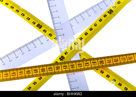 tape measures cross on white background Stock Photo