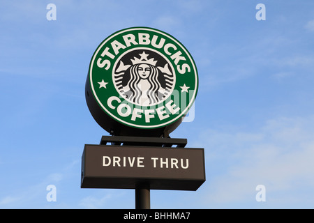 A sign outside of a Starbucks drive thru coffee shop.
