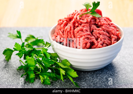 Close up on bowl of lean red raw ground meat Stock Photo