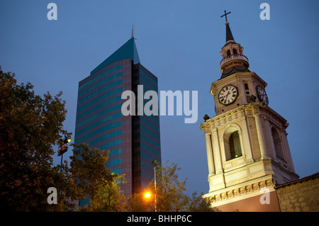 San Francisco Cathedral and a modern skyscraper in Santiago, Chile at Dusk Stock Photo