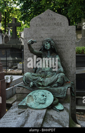 Grave of Gustave Guillaumet (1840-87), orientalist painter, in Montmartre Cemetery Paris features a young girl by the sculptor Louis-Ernest Barrias. Stock Photo