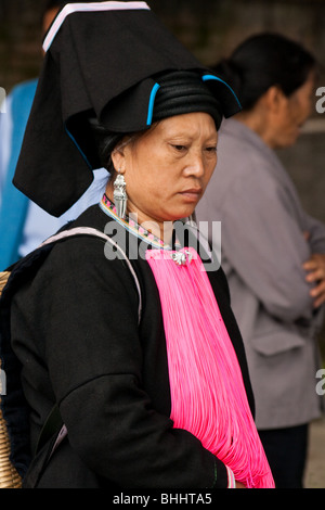 Yao tribal woman at Yuanyuang market in Yunnan, China. Stock Photo