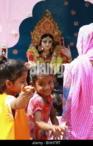 Happy smiley Indian kids at a Saraswati festival in Calcutta, India Stock Photo