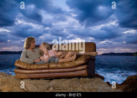 couple on couch at beach Stock Photo