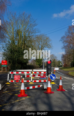 Temporary traffic lights,cones and barriers at roadworks in Seer Green Bucks UK Stock Photo