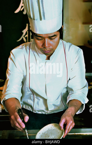 PARIS, France - Interior Japanese Restaurant, Portrait Sushi Chef, Working in Kitchen, in 'Azabu' Restaurant Stock Photo