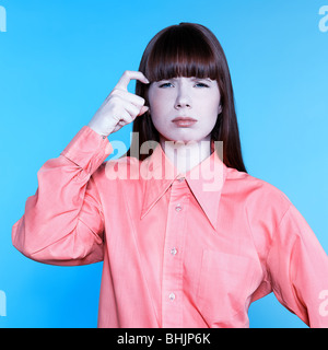 studio portrait of a young woman on isolated background gesturing bad mood Stock Photo