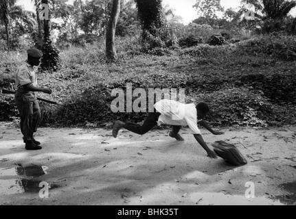 geography / travel, Congo, events, Simba uprising 1964 - 1965, taking of Stanleyville by government forces, civilist is abused by a soldier, December 1964, Stock Photo