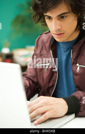 Young man using laptop Stock Photo