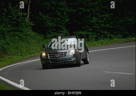 Cadillac CTS saloon cornering at speed Stock Photo