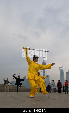 People exercising along the Huang Pu riverfront overlooking the Pudong in Shanghai, China, Asia Stock Photo