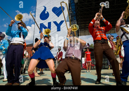 'Mucca Pazza,' a marching band from Chicago, performs at McCarren Park Pool in Brooklyn, NY. Stock Photo