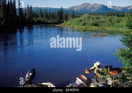 A fishing guide on River Talachulitna with a shot gun as protection against  Bears Stock Photo - Alamy