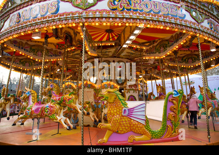 Hyde Park Winter Wonderland small child on a funfair carousel at Hyde Park winter wonderland,London,England, 2008 Stock Photo