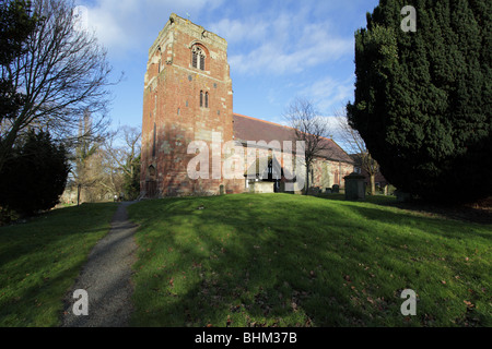 Cast in red sandstone the idyllic Church of St Eata at Atcham in Shropshire, England. Stock Photo
