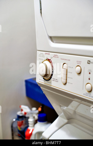Top Loading Clothes Dryer and Washer in a Laundry Room Stock Photo