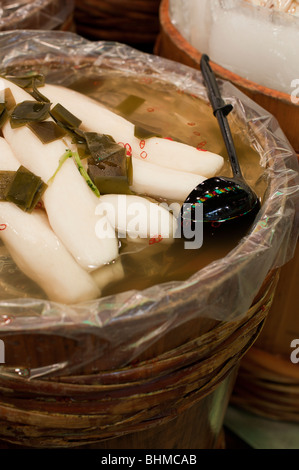 Japanese tsukemono, pickled daikon radishes, for sale at the Nishiki market, Kyoto, Japan Stock Photo