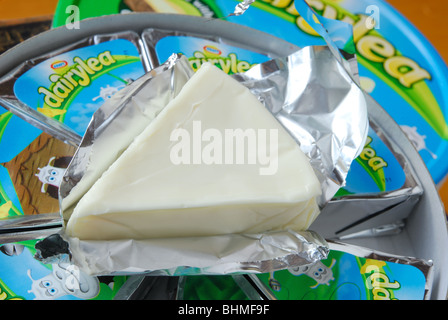 A Kraft Dairylea cheese triangle, unwrapped from its foil. Stock Photo