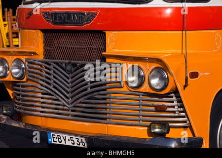 Front of vintage Yellow and gold British Leyland  bus in Mosta, Malta Stock Photo