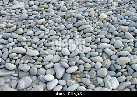 smooth beach stones on a beach Stock Photo