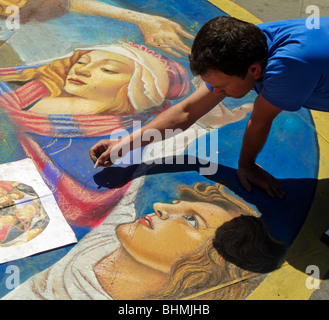 Pavement artist at work in Florence, Italy. No model release, editorial use only. Stock Photo
