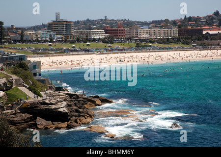 Sydneys famous Bondi Beach one of the iconic tourist attractions of the city draws thousands of visitors daily during summer Stock Photo