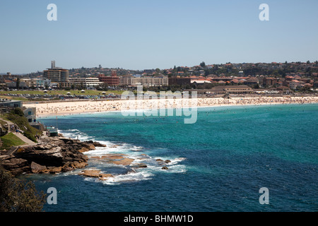 Sydneys famous Bondi Beach one of the iconic tourist attractions of the city draws thousands of visitors daily during summer Stock Photo