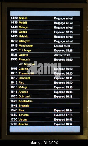 Airport electronic flight arrival and departure information board - image taken at London Airport - Gatwick Stock Photo