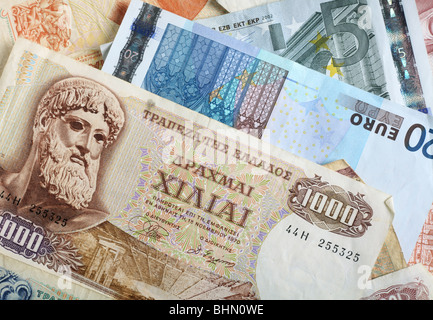 A mixture of old Greek drachma banknotes and euro notes that succeeded them. Stock Photo