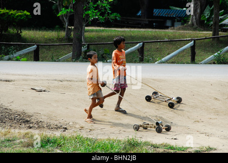 young karen boys skateboarding , mae la  refugee camp(thai burmese border) , north of mae sot , tak province , north thailand Stock Photo