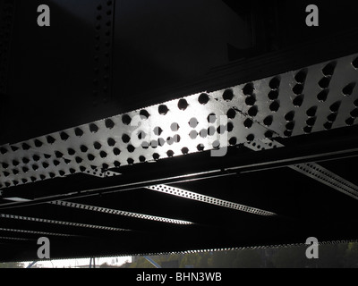 Steel rivet heads on a girder under a bridge Stock Photo