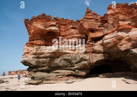 Rugged red cliff and sandstone rock formations at Echo Beach on the West Australian coast near Broome Stock Photo