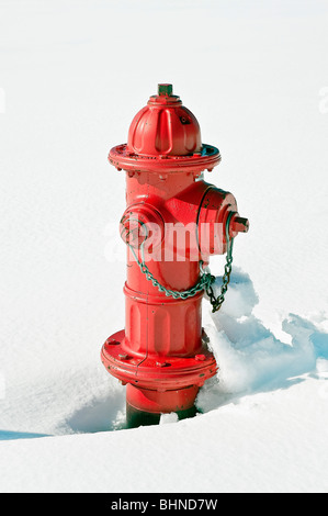 Red fire hydrant in snow. Stock Photo