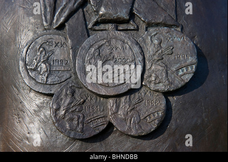 Olympic medals on Sir Steve Redgrave's statue outside Court Gardens house Marlow Buckinghamshire UK Stock Photo